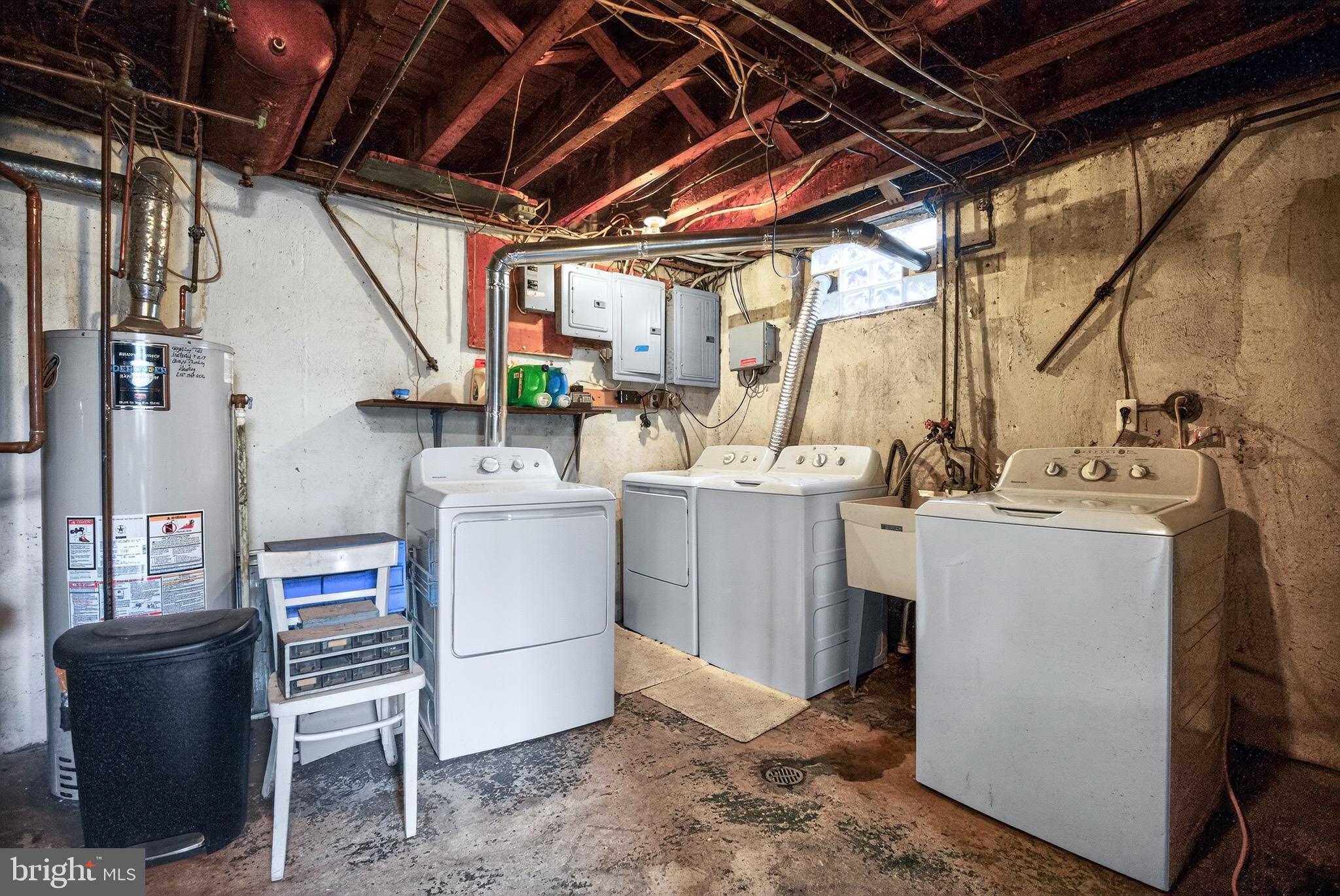 4401 Manayunk Avenue Philadelphia, PA 19128 - Photo 21 of 25 a utility room with a sink dryer and washer