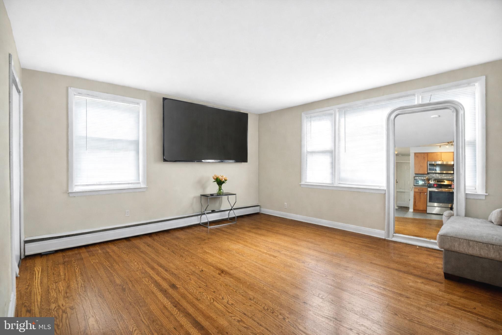 4401 Manayunk Avenue Philadelphia, PA 19128 - Photo 6 of 25 a view of a livingroom with wooden floor and a window