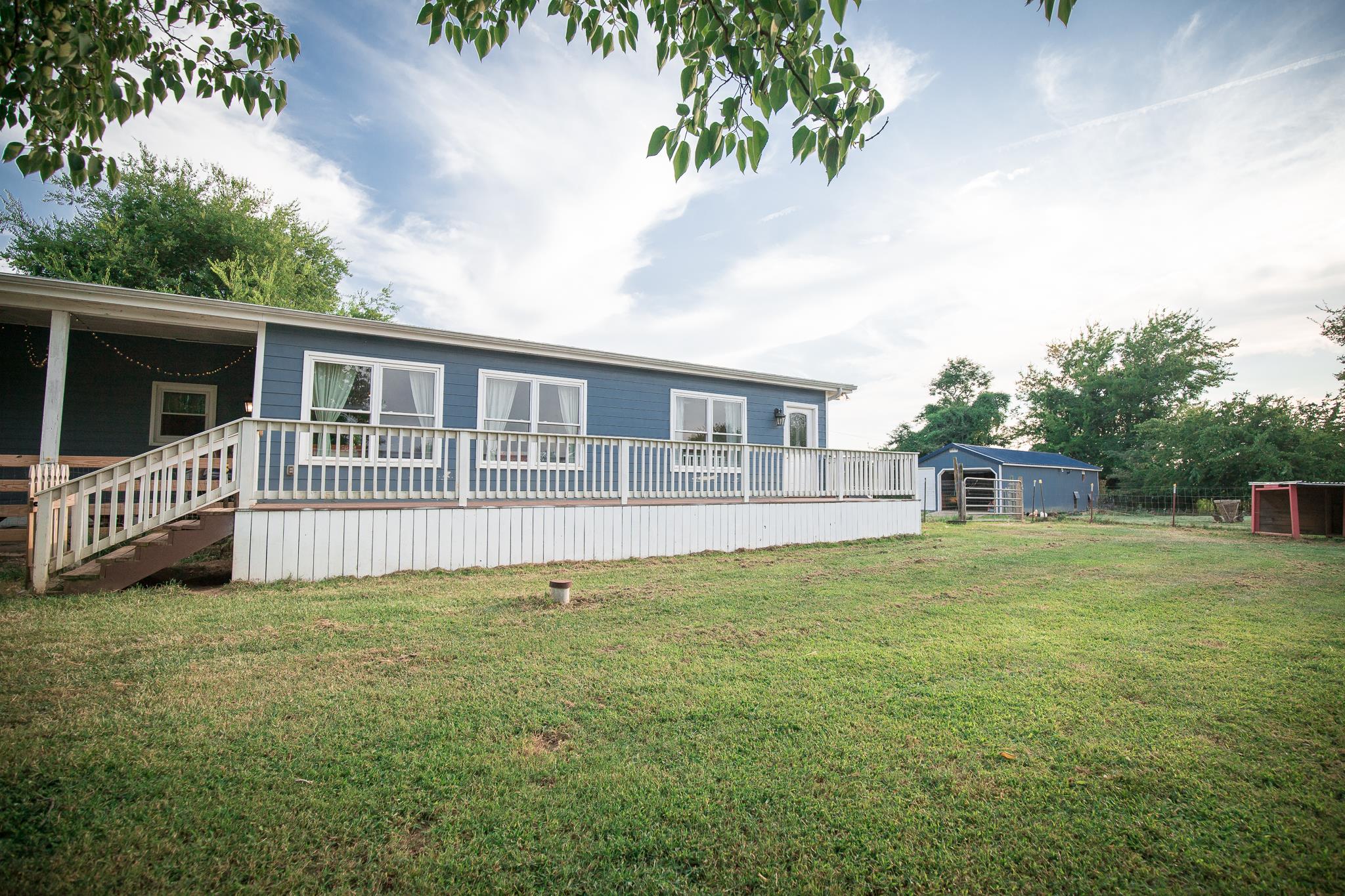 420 Squire Hall Road Bell Buckle, TN 37020 - Photo 17 of 23 a view of a house with a yard and deck