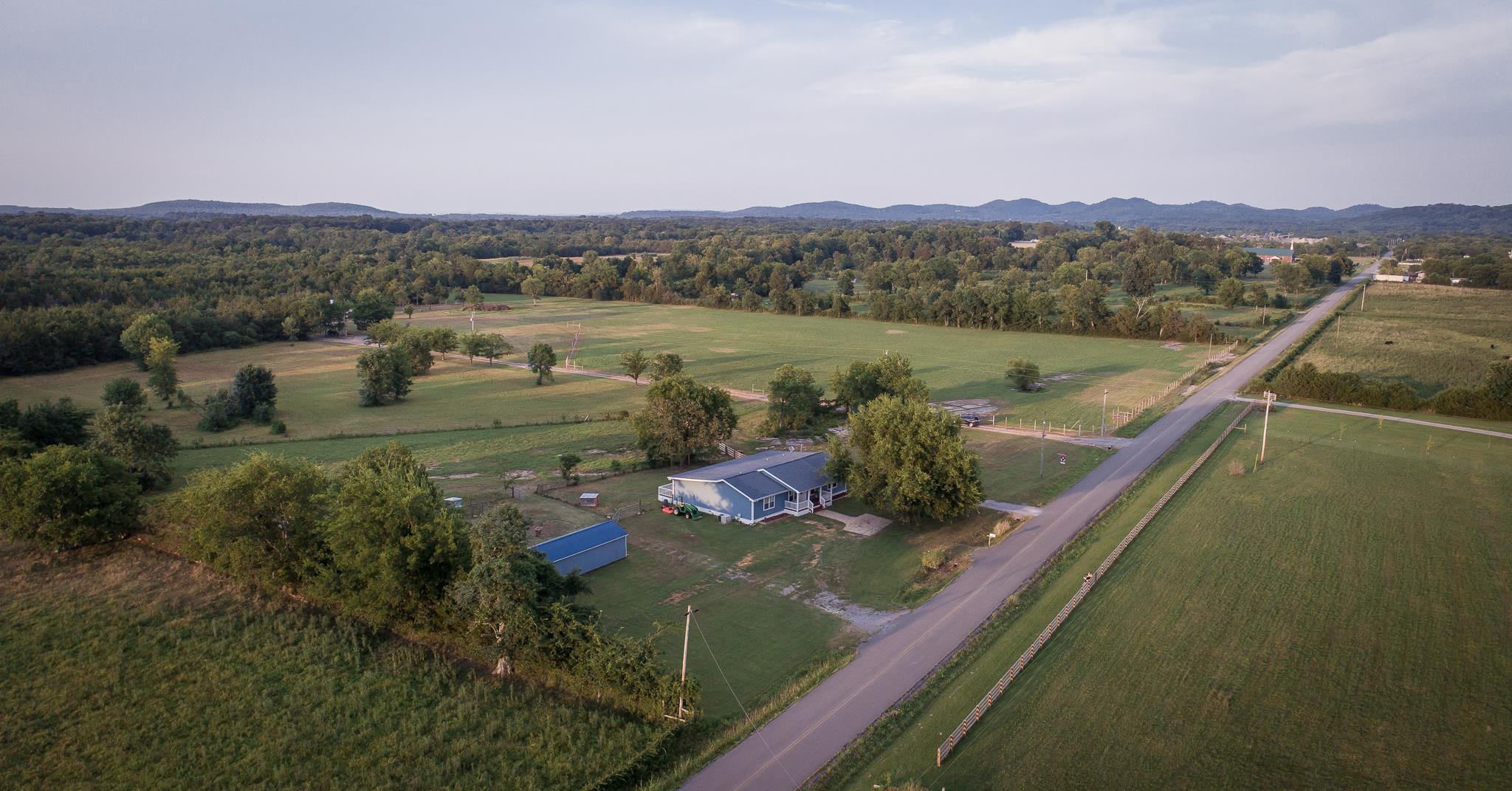 420 Squire Hall Road Bell Buckle, TN 37020 - Photo 21 of 23 a view of a lake with a mountain