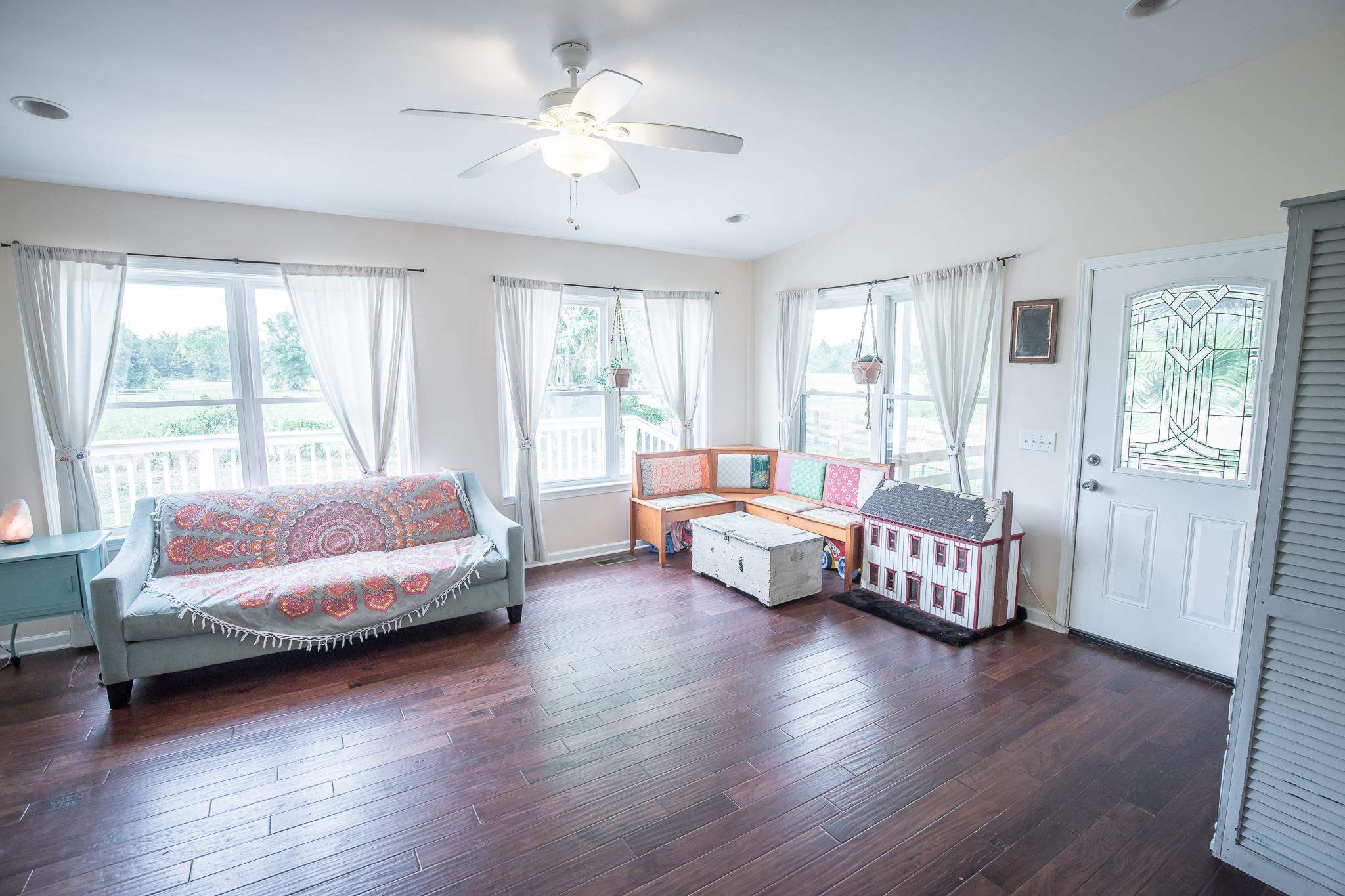 420 Squire Hall Road Bell Buckle, TN 37020 - Photo 8 of 23 a spacious bedroom with a bed and a large window