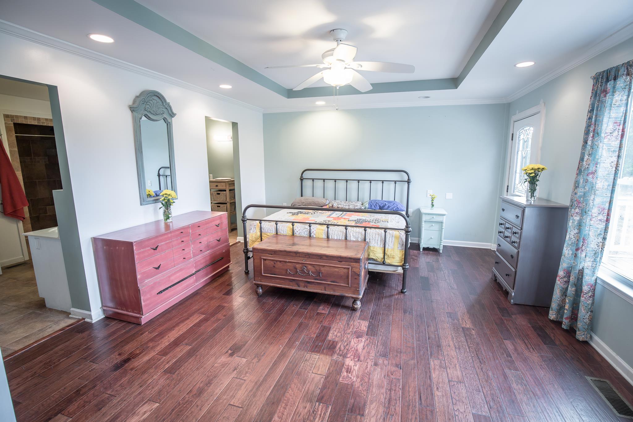 420 Squire Hall Road Bell Buckle, TN 37020 - Photo 9 of 23 a bedroom with a bed and wooden floor