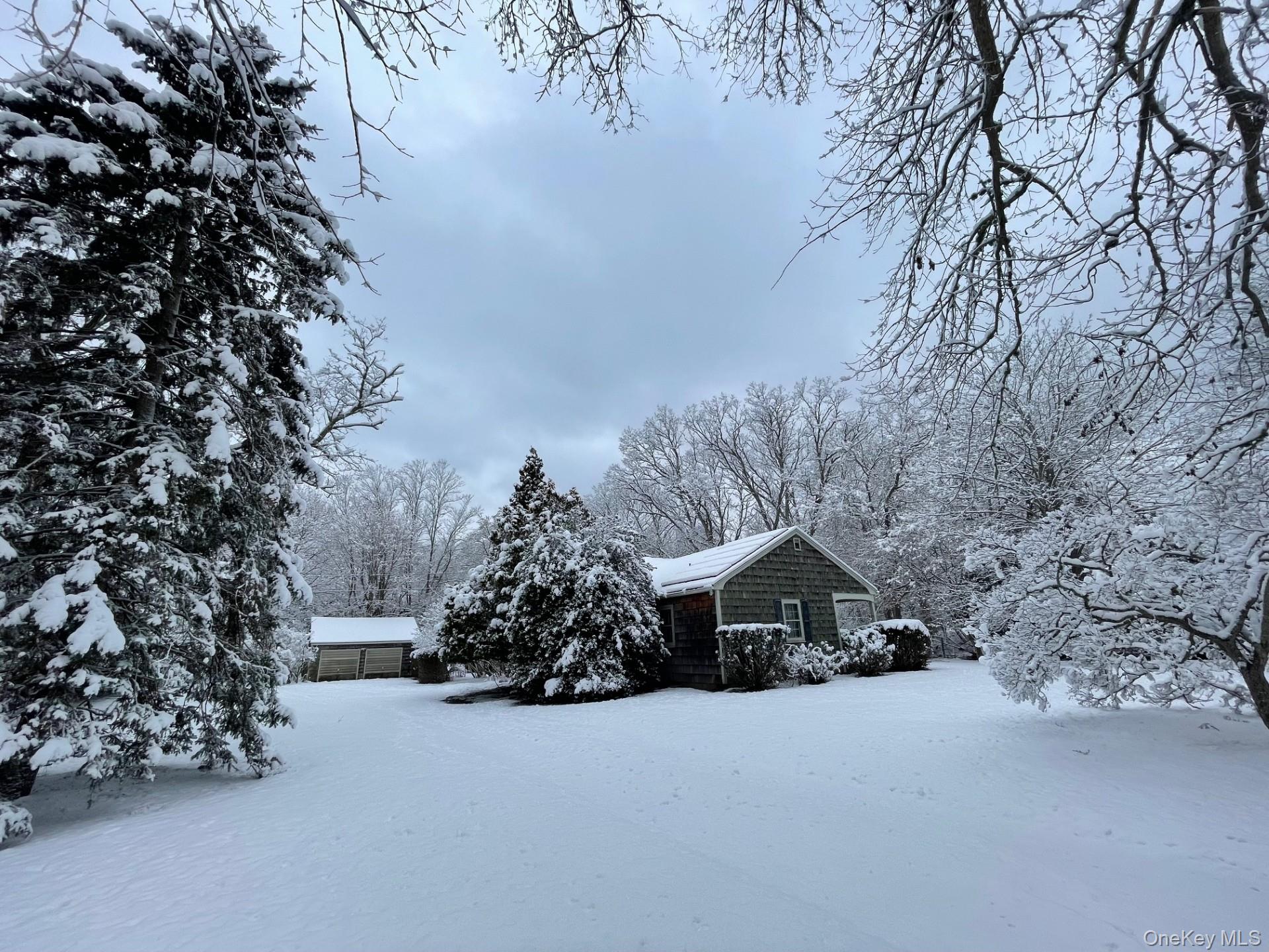 a view of a house with a snow in a yard
