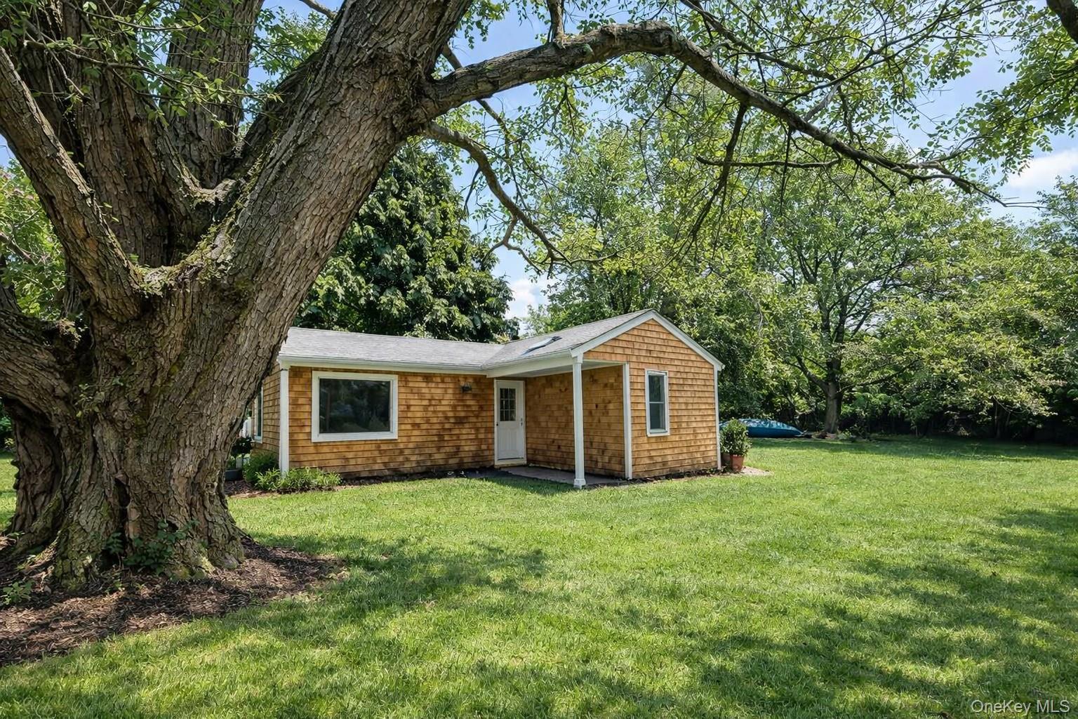 a view of a house with a yard