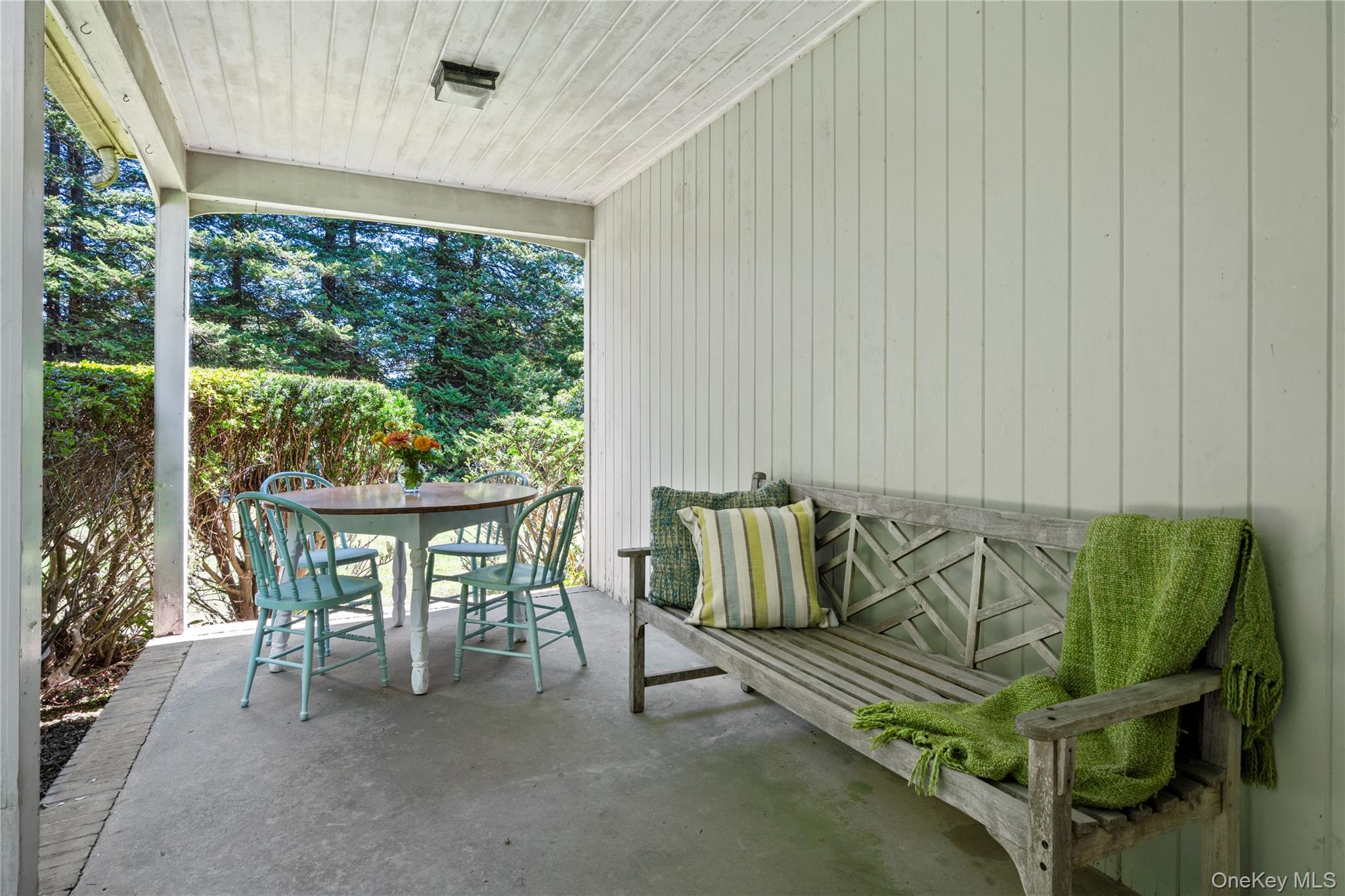 26 South Menantic Road Shelter Island, NY 11964 - Photo 11 of 49 a balcony with furniture and a potted plant