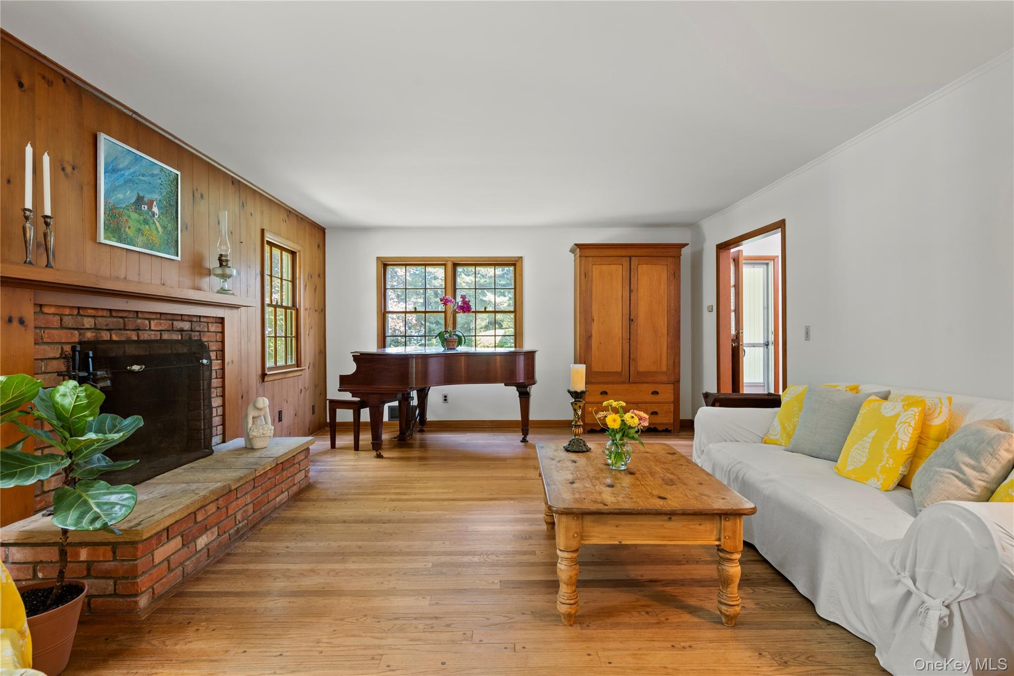26 South Menantic Road Shelter Island, NY 11964 - Photo 14 of 49 a living room with furniture fireplace and window