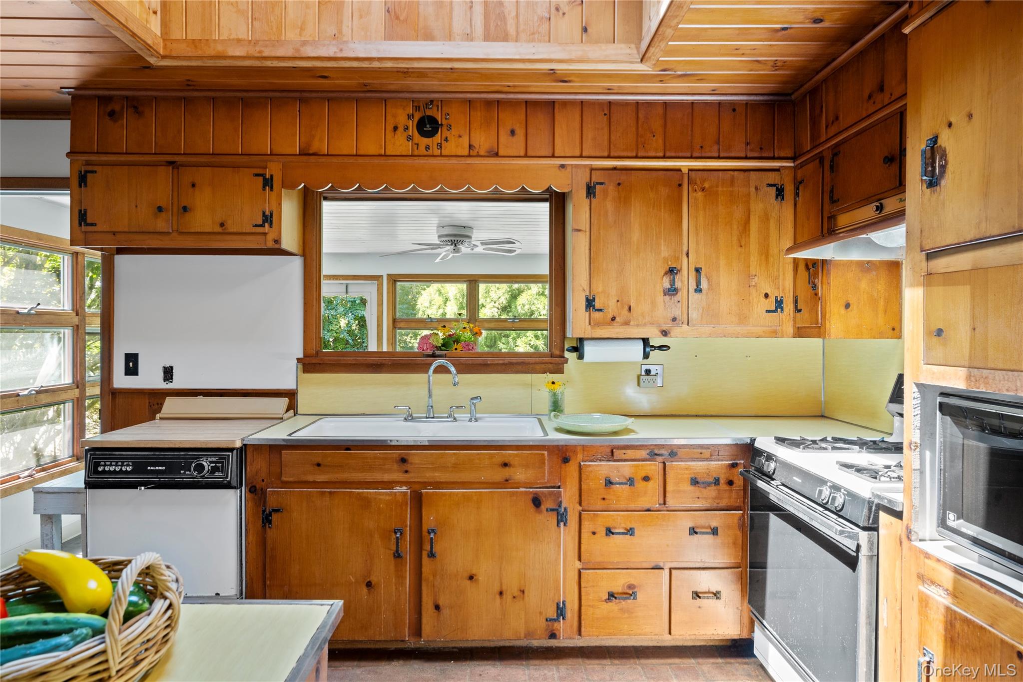 26 South Menantic Road Shelter Island, NY 11964 - Photo 15 of 42 a kitchen with stainless steel appliances granite countertop a sink and a stove