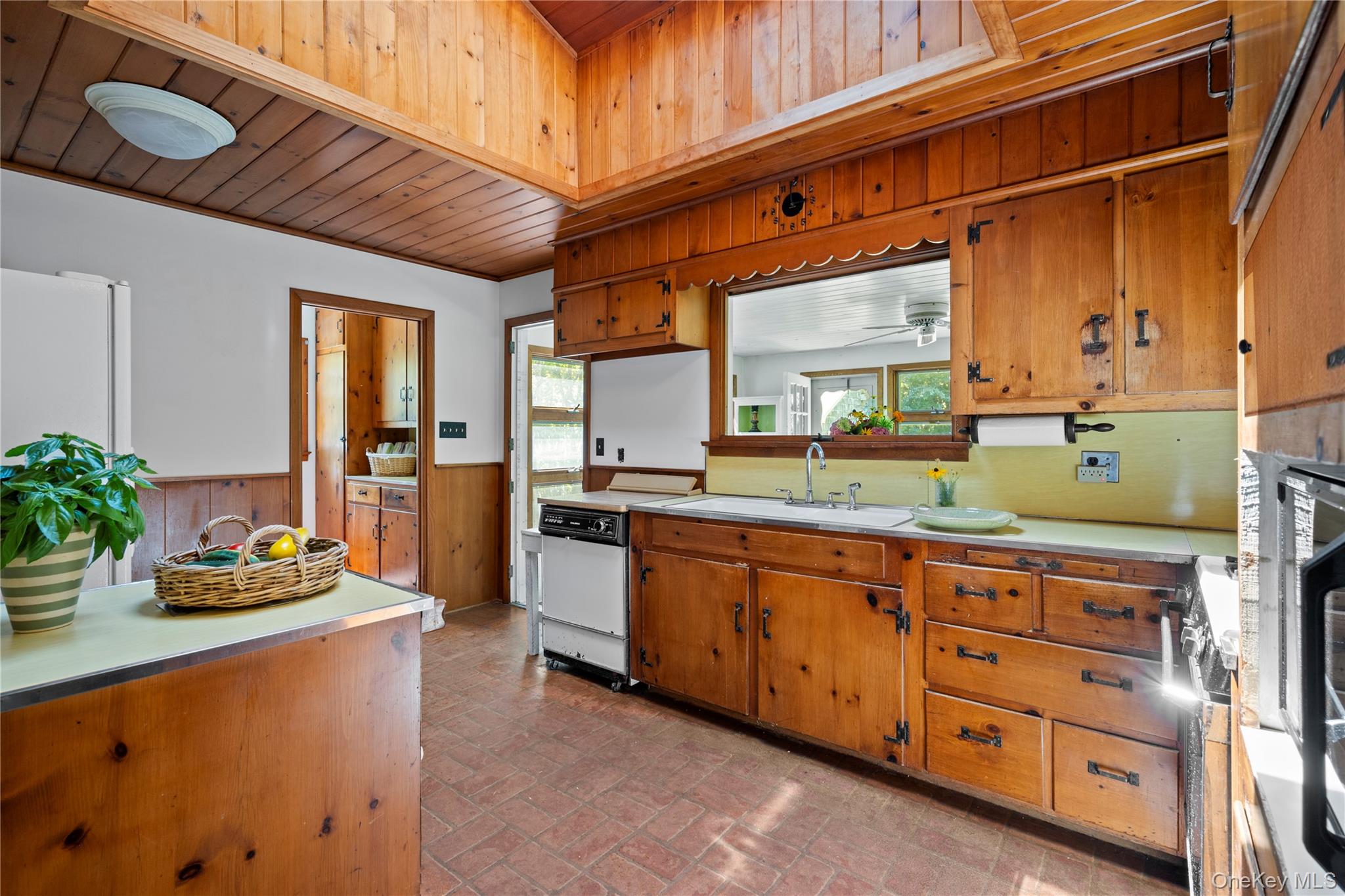 26 South Menantic Road Shelter Island, NY 11964 - Photo 20 of 49 a large kitchen with stainless steel appliances granite countertop a sink and cabinets