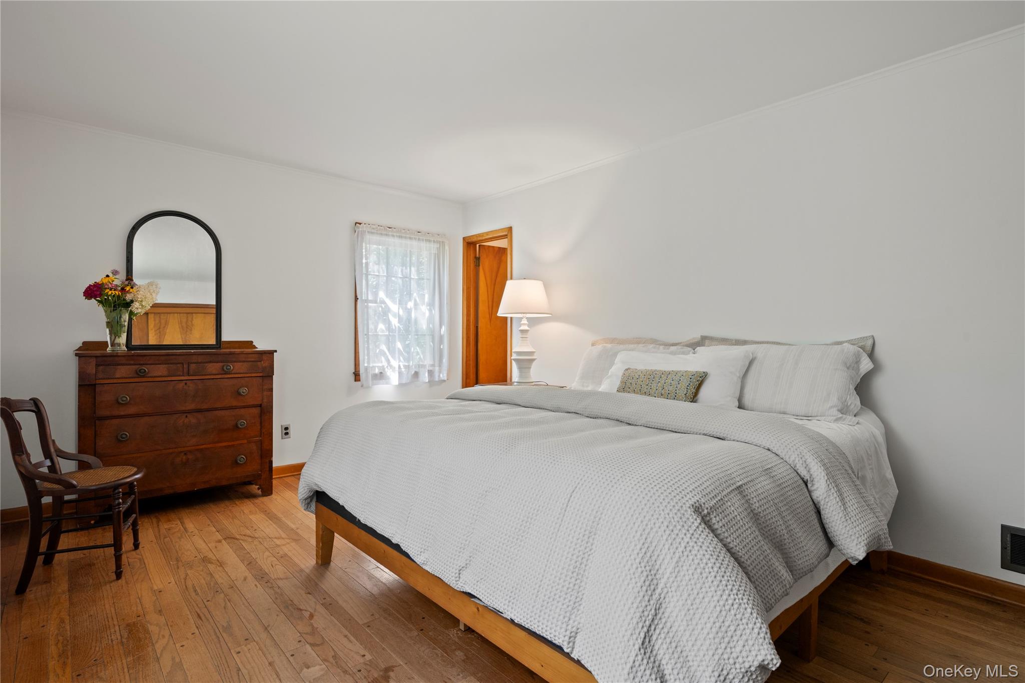 26 South Menantic Road Shelter Island, NY 11964 - Photo 31 of 49 a bedroom with a bed and a dresser