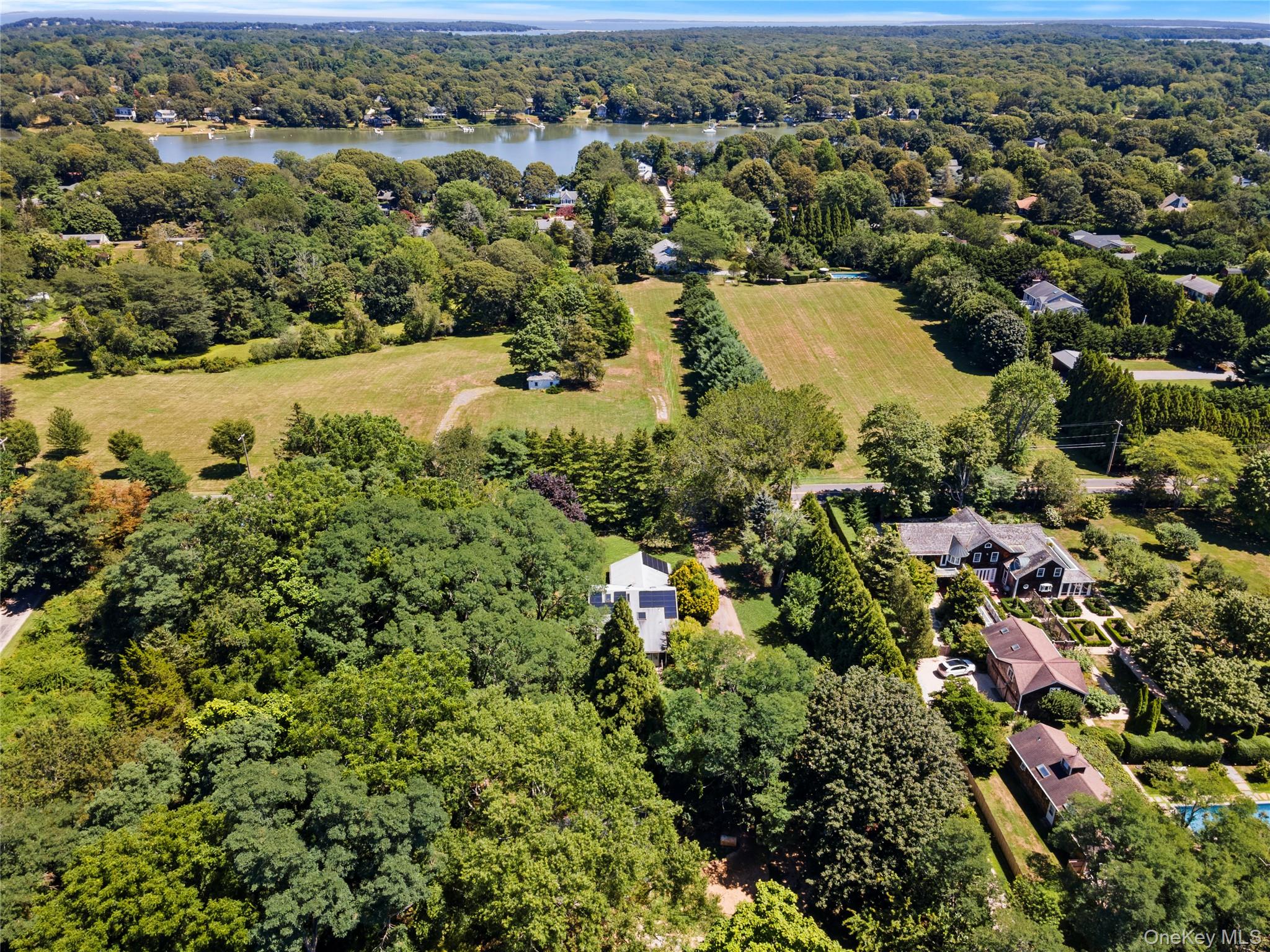 26 South Menantic Road Shelter Island, NY 11964 - Photo 36 of 42 an aerial view of residential houses with outdoor space and trees