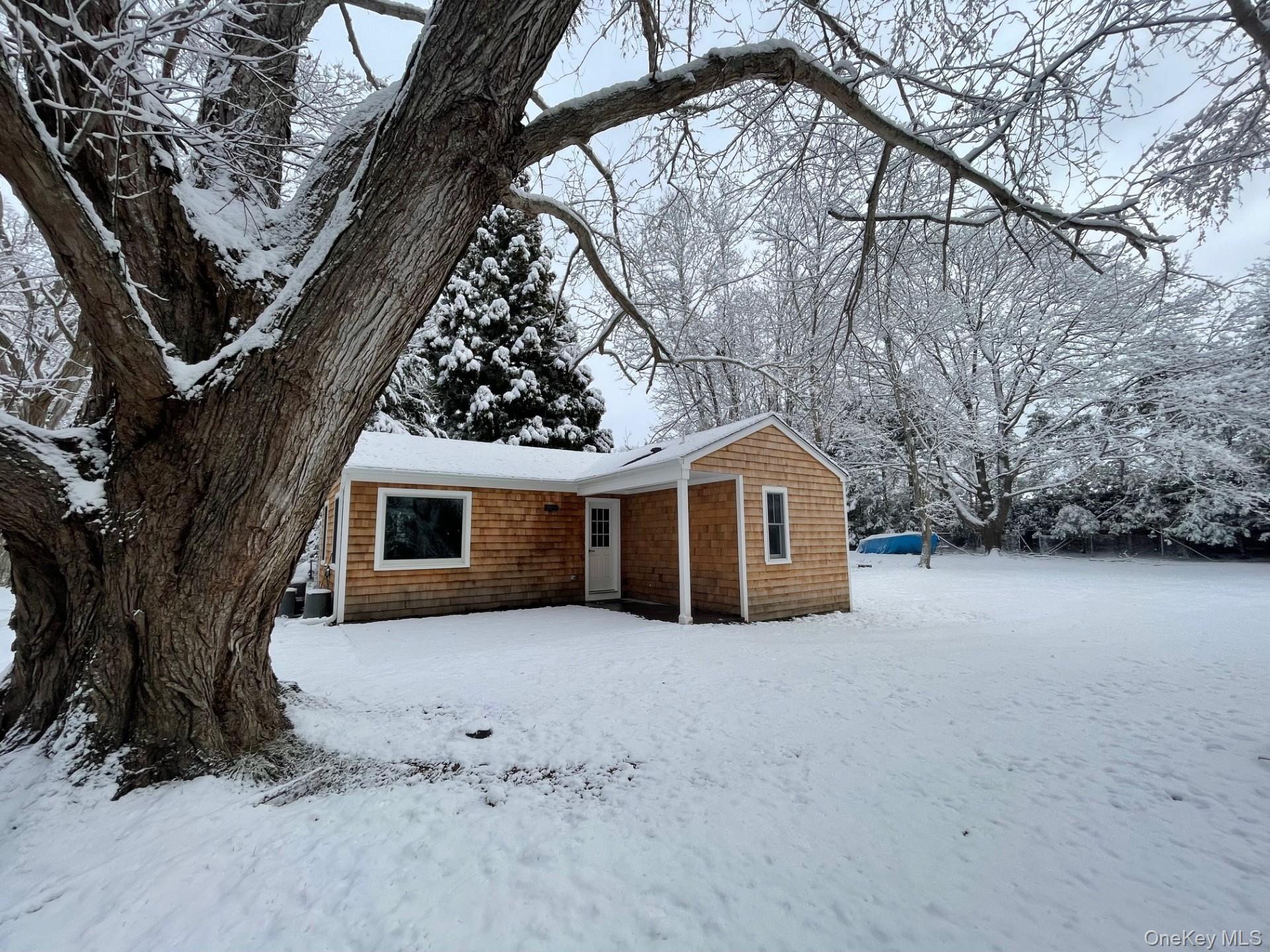 26 South Menantic Road Shelter Island, NY 11964 - Photo 47 of 49 a view of a house with a snow in the yard