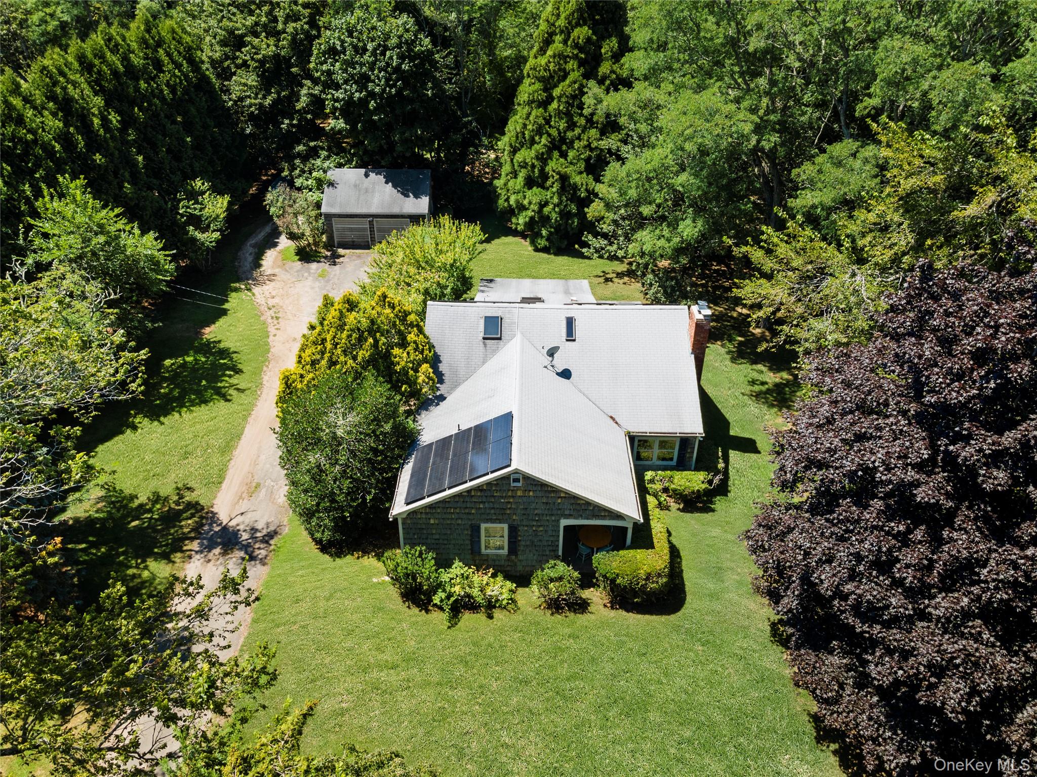 26 South Menantic Road Shelter Island, NY 11964 - Photo 9 of 49 an aerial view of a house