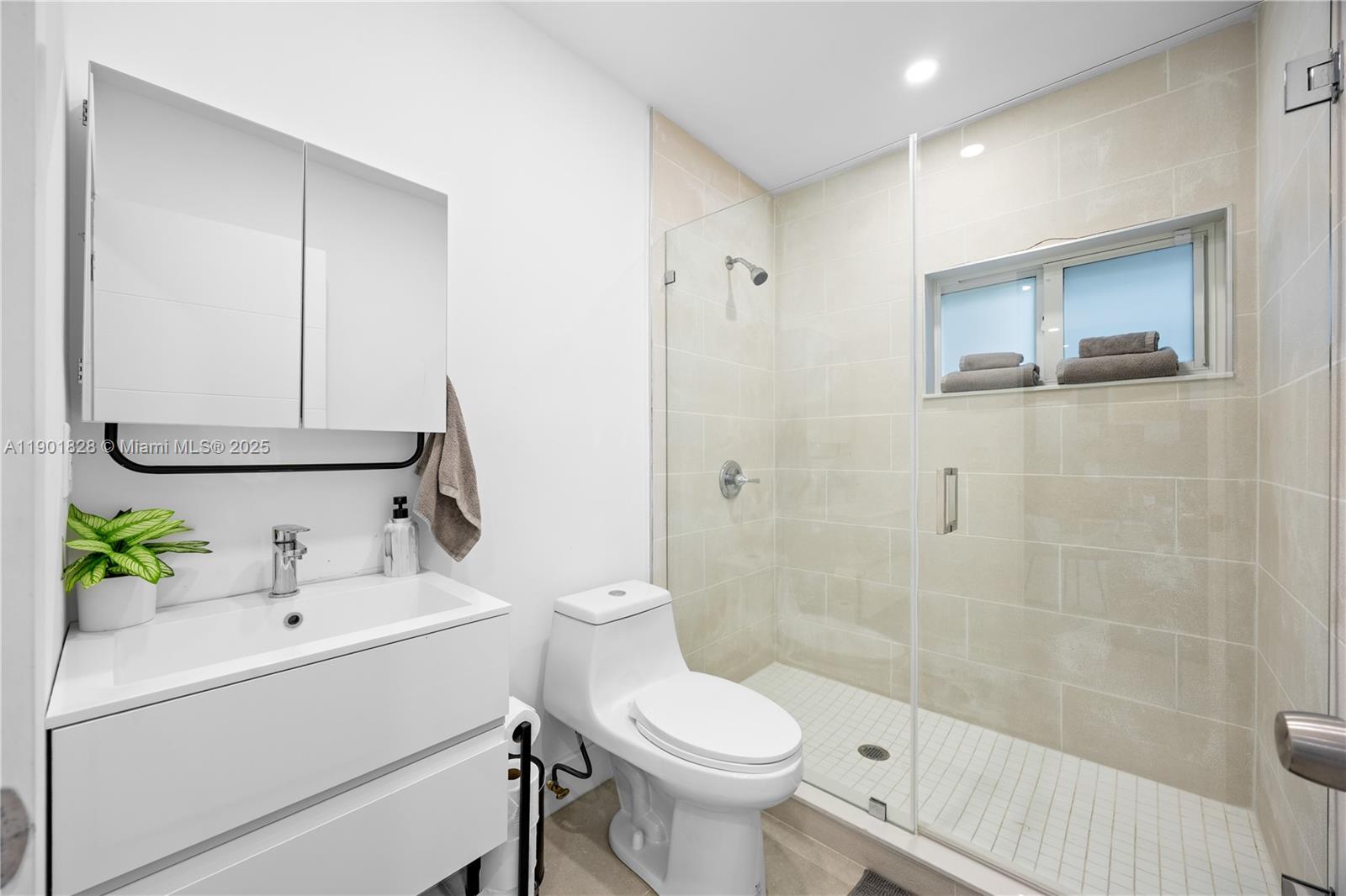 11 Northwest 45th Street Miami, FL 33127 - Photo 12 of 28 a bathroom with a sink toilet and shower