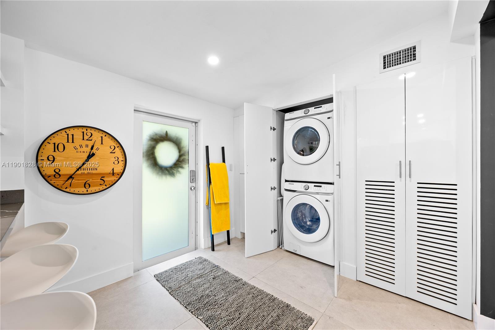 11 Northwest 45th Street Miami, FL 33127 - Photo 20 of 28 a view of a livingroom with furniture and washing machine