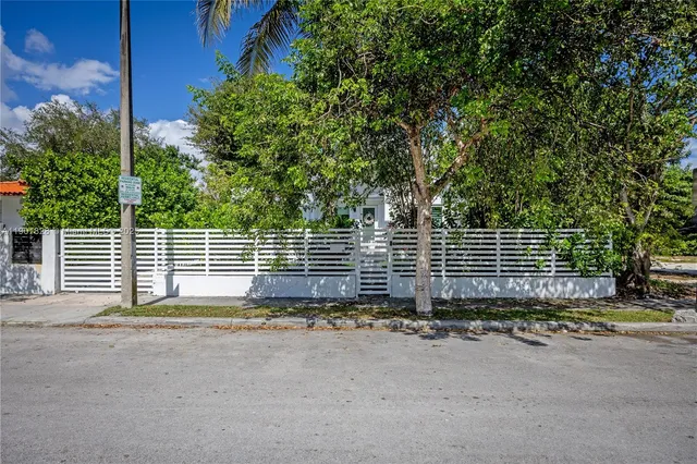 a view of a backyard with swimming pool