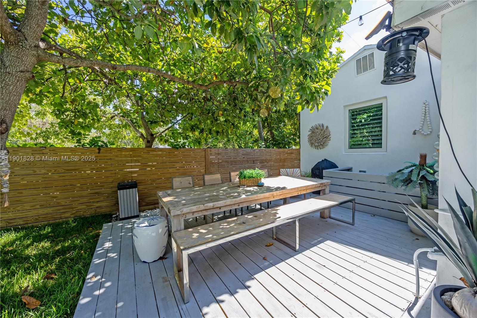 11 Northwest 45th Street Miami, FL 33127 - Photo 24 of 28 a view of a balcony with two chairs and a table