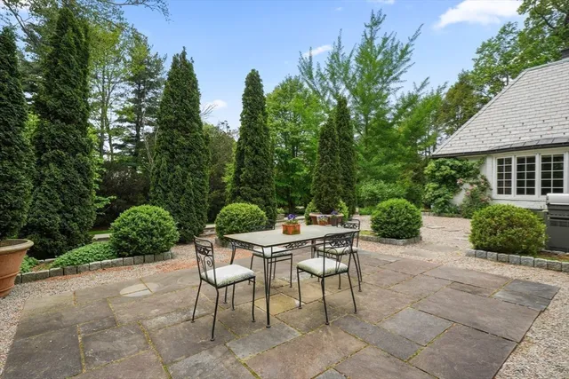 a yard with table and a chairs