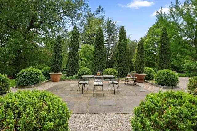 a view of a table and chairs in the garden