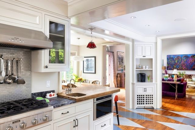 a kitchen with stainless steel appliances granite countertop a stove and a sink