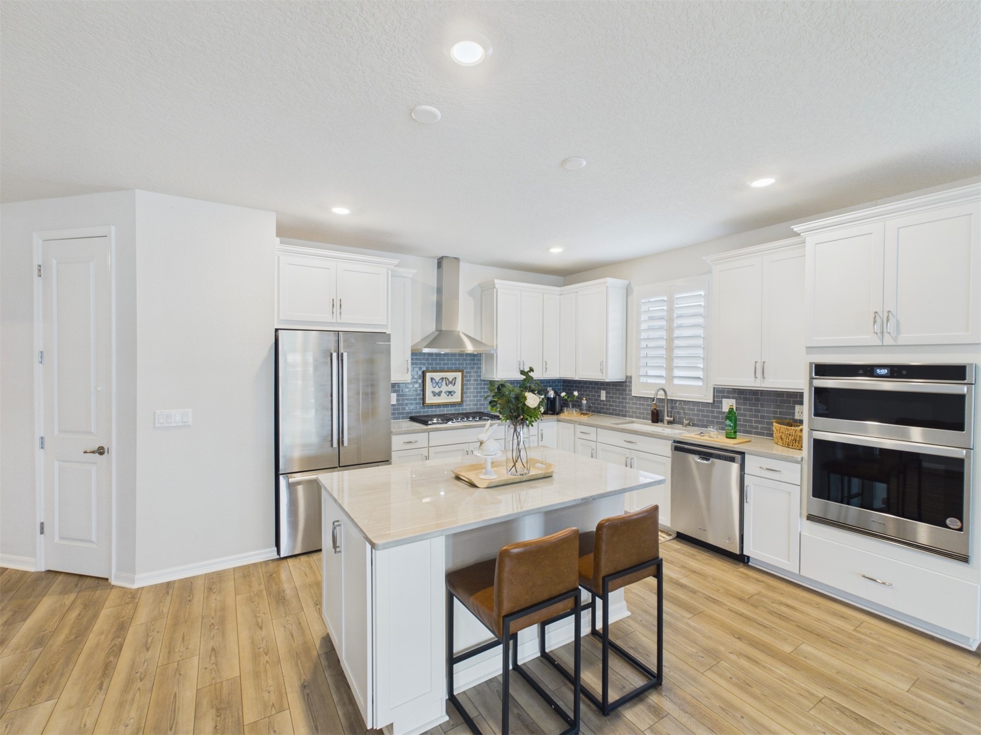 312 Salt Meadow Loop Yulee, FL 32097 - Photo 7 of 22 a kitchen with refrigerator and cabinets