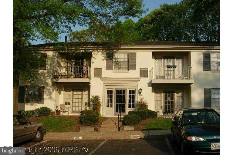 5907L Kingsford Road, Unit 402 Springfield, VA 22152 - Photo 1 of 8 a front view of a house with garden