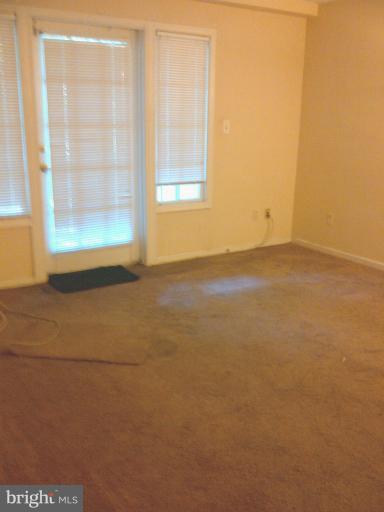 5907L Kingsford Road, Unit 402 Springfield, VA 22152 - Photo 2 of 8 a view of an empty room with a window