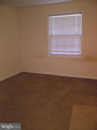5907L Kingsford Road, Unit 402 Springfield, VA 22152 - Photo 3 of 8 an empty room with a window