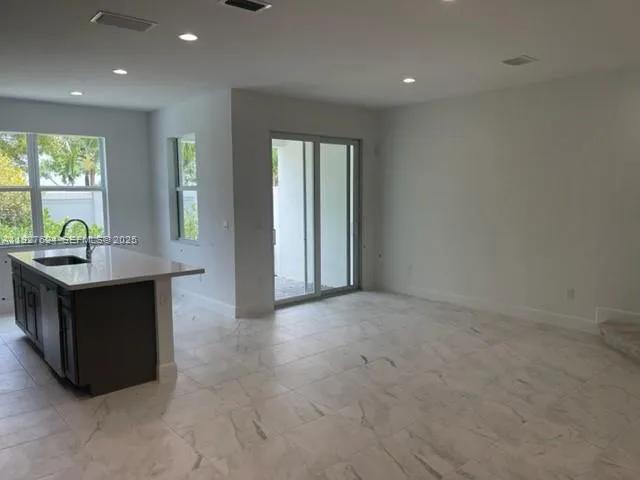 a living room with furniture and window