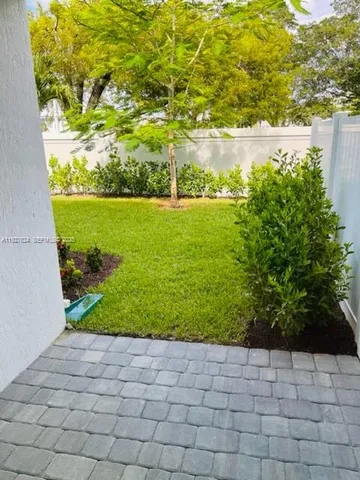 a view of a yard with an trees