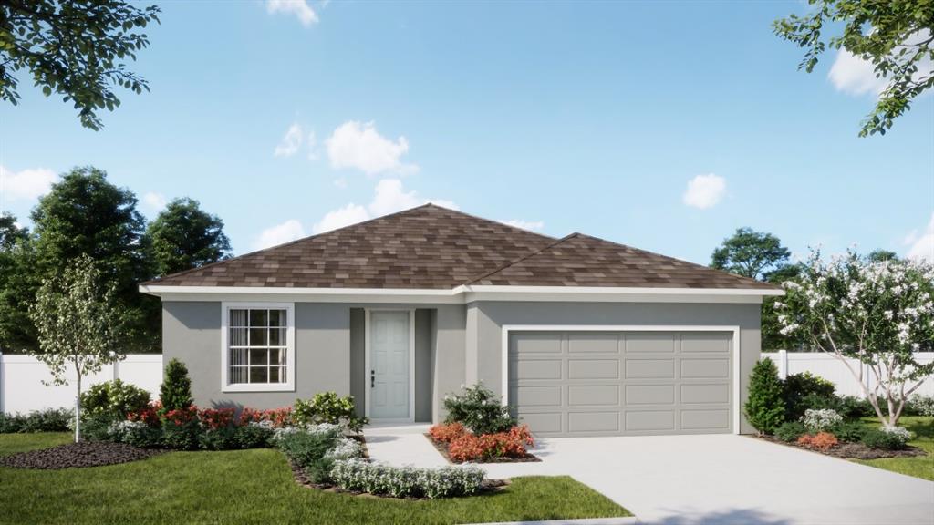 6140 Success Way St. Cloud, FL 34771 - Photo 1 of 6 a front view of a house with a garden and plants