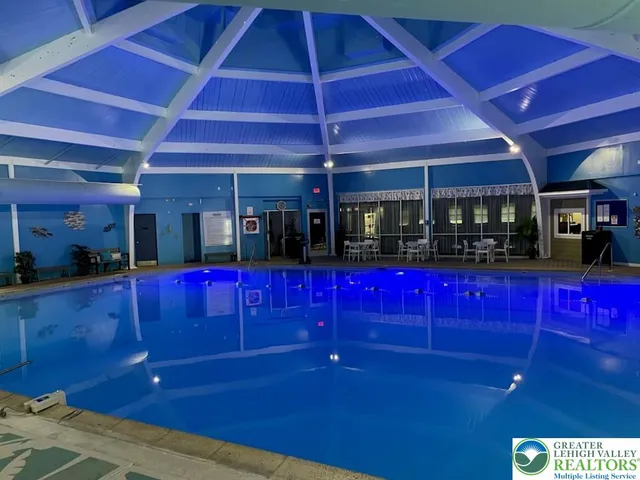 a bathroom with a shower and a sink
