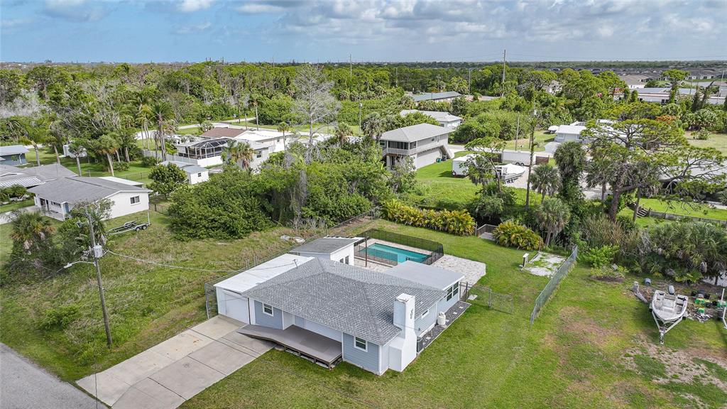 8164 Archie Street Englewood, FL 34224 - Photo 37 of 42 an aerial view of a house with a garden