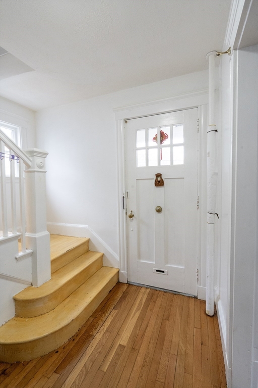 45 North Crescent Circle Sudbury, MA 01776 - Photo 6 of 16 a view of an empty room with wooden floor and a window