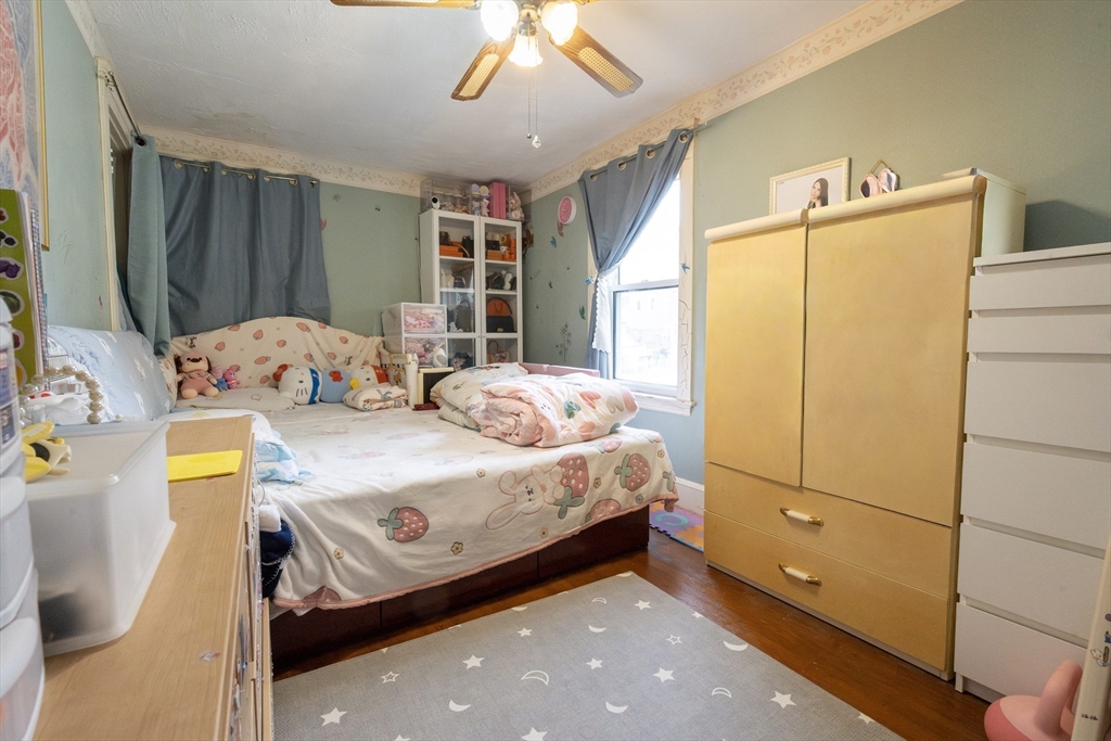 45 North Crescent Circle Sudbury, MA 01776 - Photo 9 of 16 a bedroom with a bed and a refrigerator