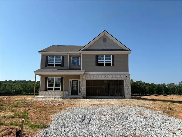 a front view of a house with yard