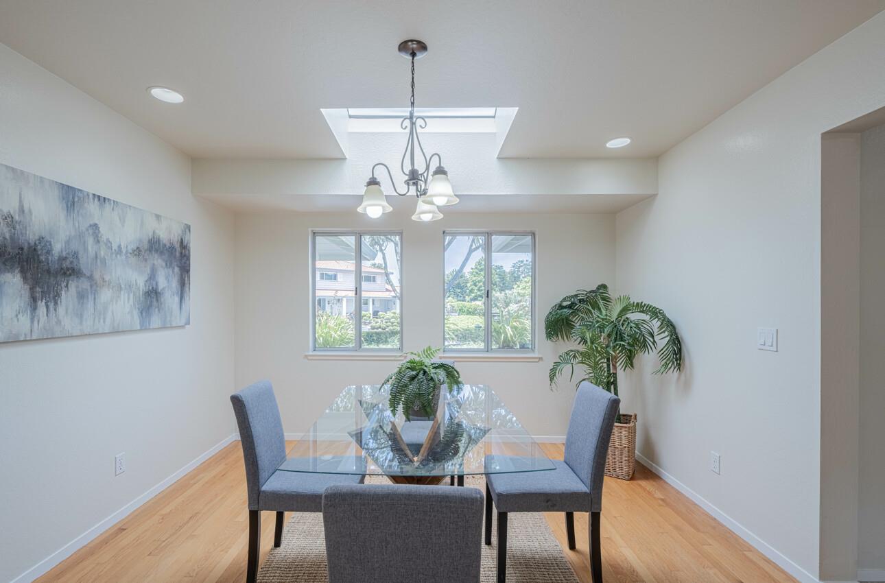 175 Tamarack Drive Aptos, CA 95003 - Photo 13 of 54 a view of a dining room with furniture a chandelier and wooden floor