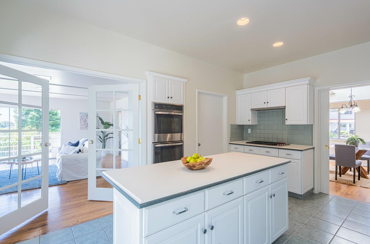 175 Tamarack Drive Aptos, CA 95003 - Photo 18 of 54 a kitchen with a sink a stove and chairs