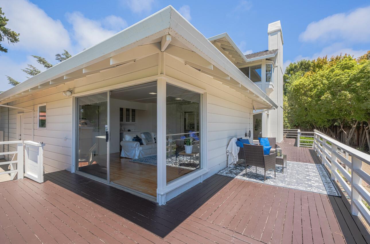 175 Tamarack Drive Aptos, CA 95003 - Photo 23 of 54 a view of a patio with table and chairs with wooden floor and fence