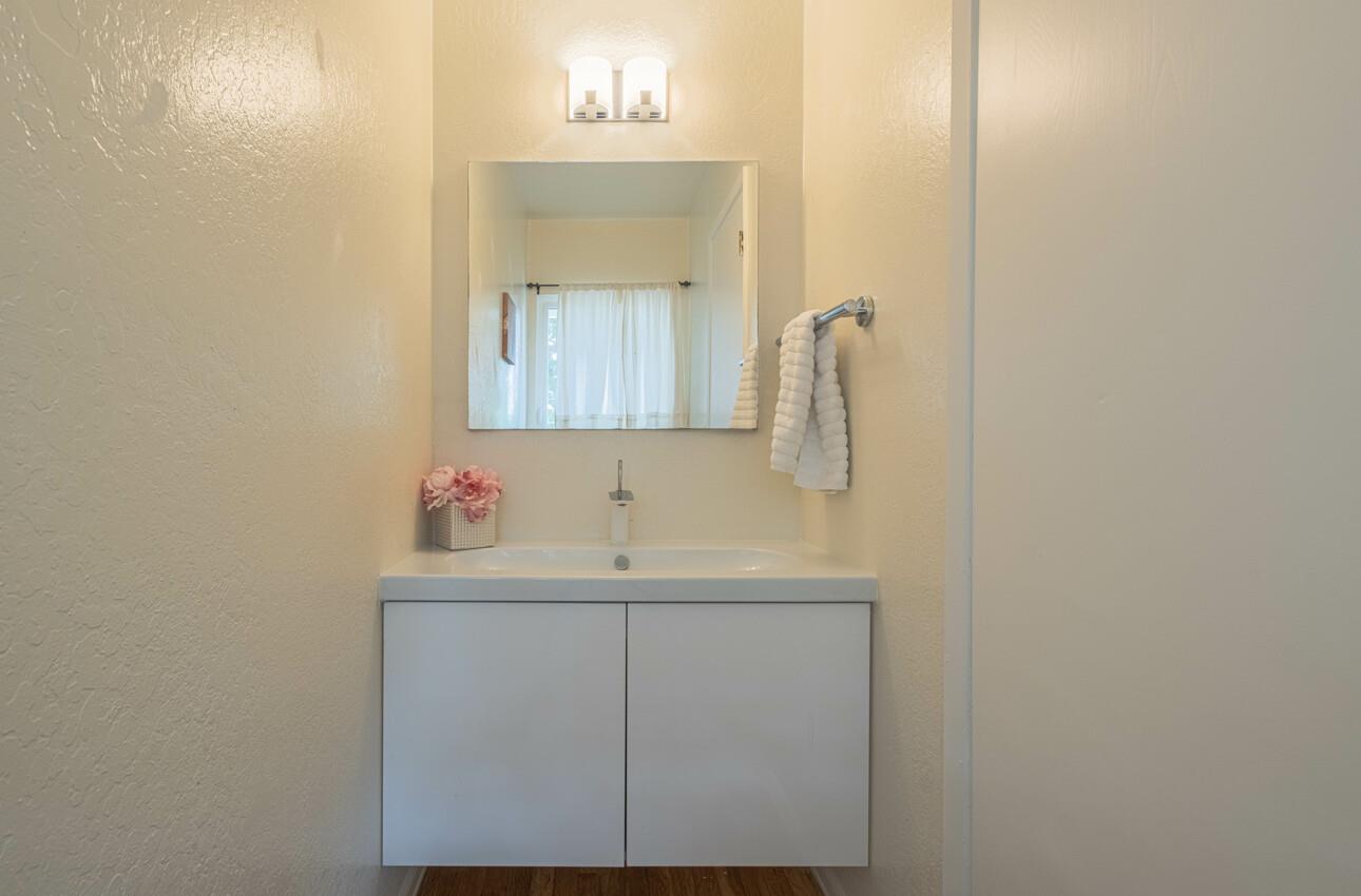 175 Tamarack Drive Aptos, CA 95003 - Photo 27 of 54 a bathroom with a sink and a mirror