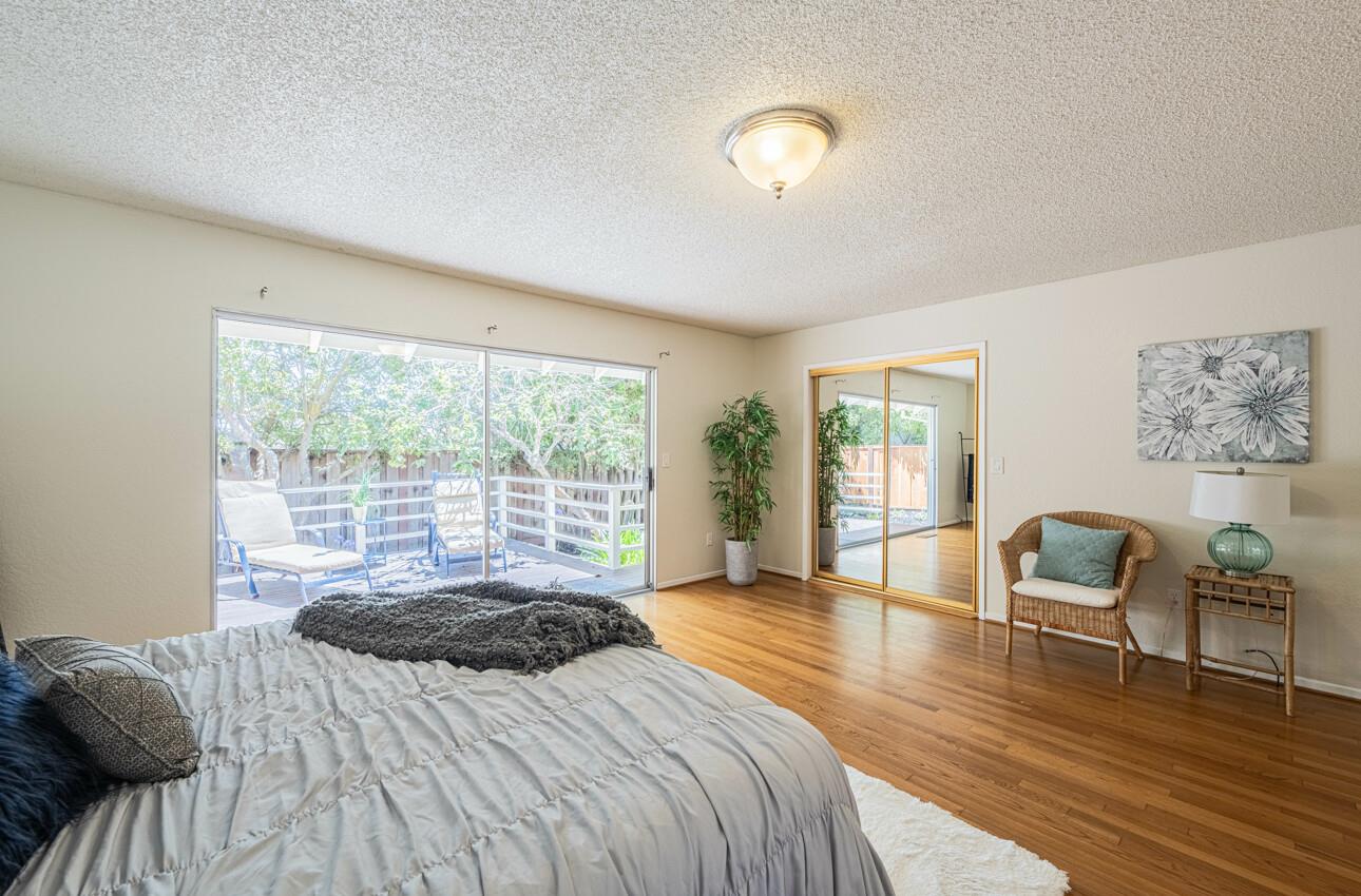 175 Tamarack Drive Aptos, CA 95003 - Photo 29 of 54 a bedroom with a bed and a chair