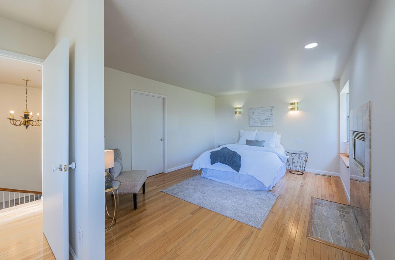 175 Tamarack Drive Aptos, CA 95003 - Photo 36 of 54 a bedroom with a bed and a table