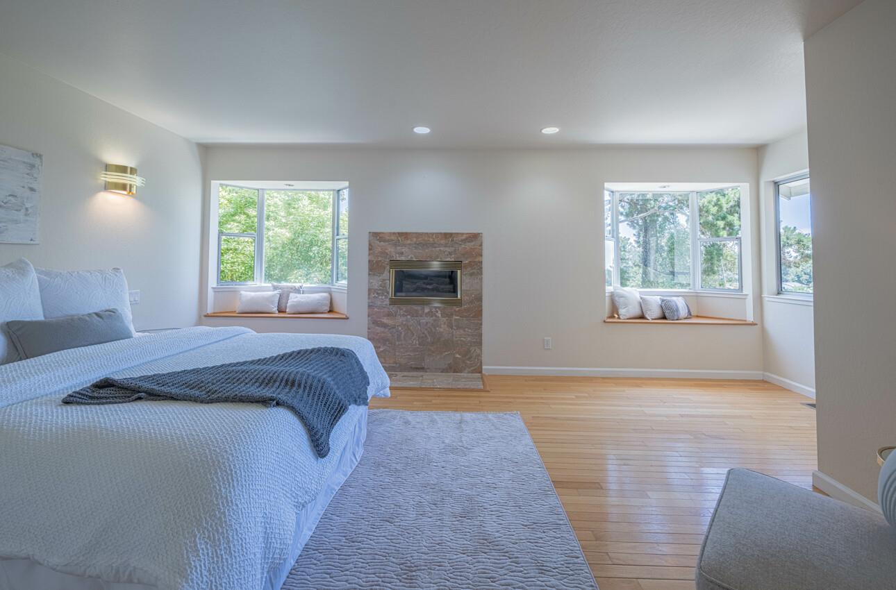 175 Tamarack Drive Aptos, CA 95003 - Photo 37 of 54 a spacious bedroom with a large bed and a couch