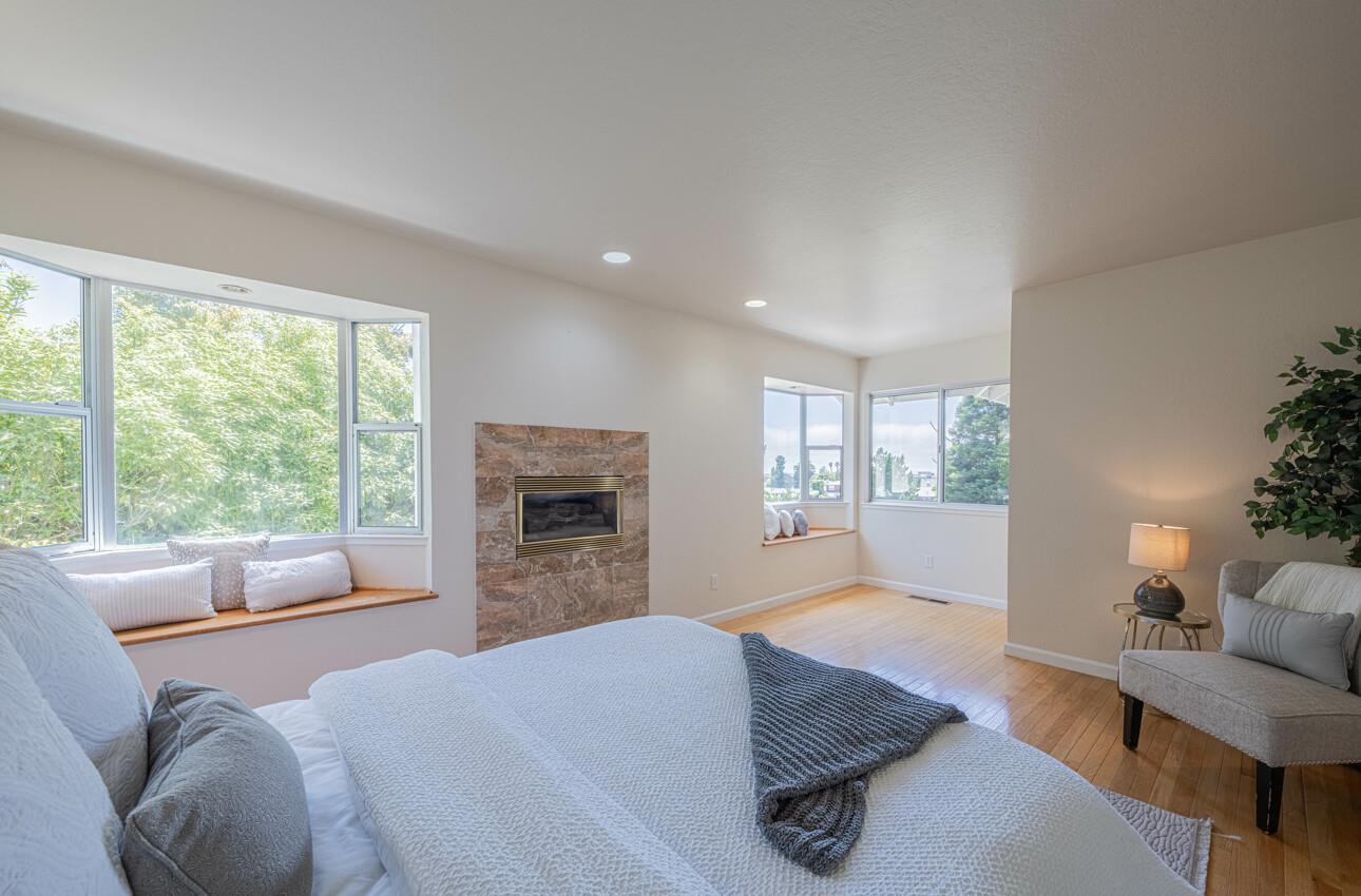 175 Tamarack Drive Aptos, CA 95003 - Photo 38 of 54 a bed room with furniture and a fireplace