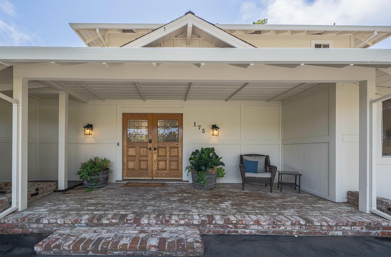 175 Tamarack Drive Aptos, CA 95003 - Photo 5 of 54 a view of a house with potted plants and a table
