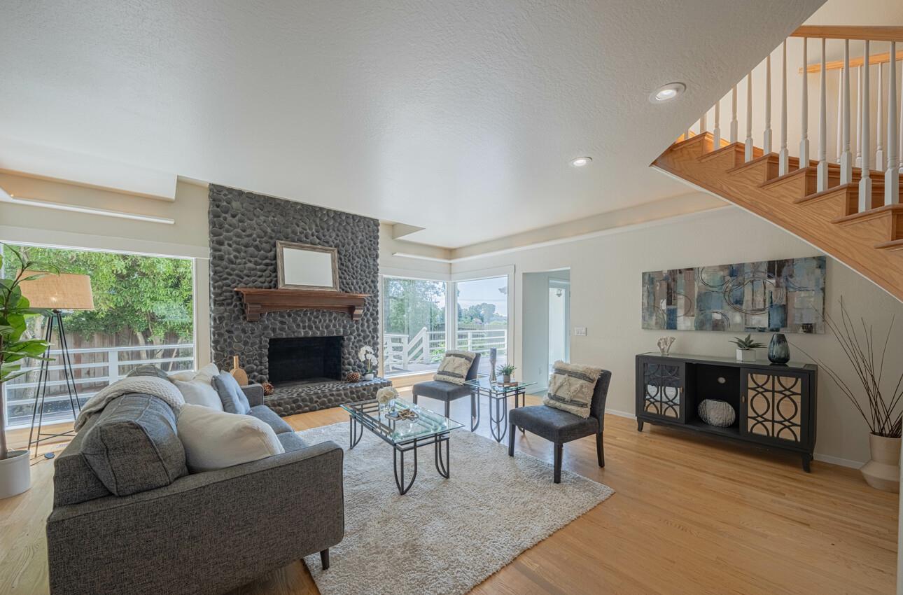 175 Tamarack Drive Aptos, CA 95003 - Photo 8 of 54 a living room with furniture a fireplace and a large window