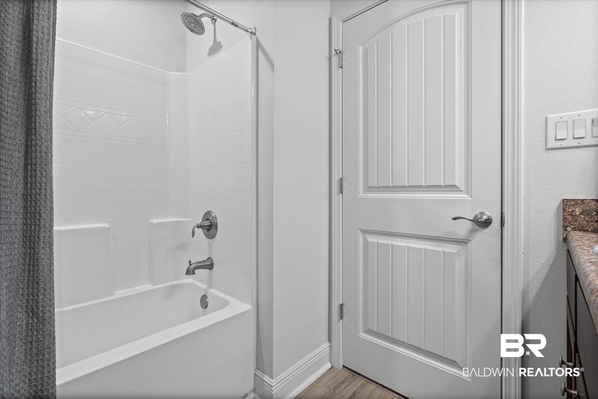 22420 Respite Lane Foley, AL 36535 - Photo 17 of 35 White tub and shower combination with chrome fixtures