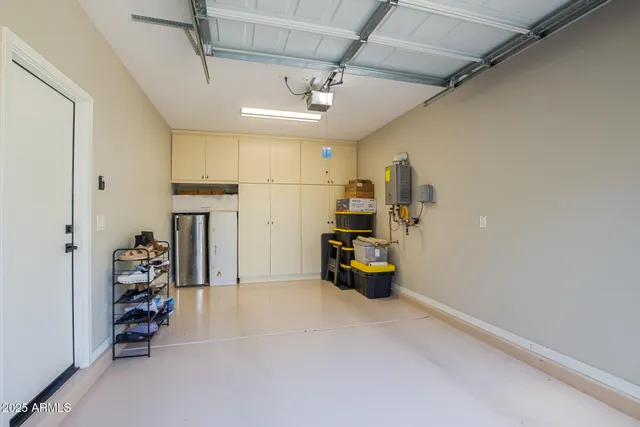 an empty room with furniture and gym equipment