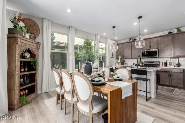 a kitchen with kitchen island granite countertop a sink cabinets and stainless steel appliances