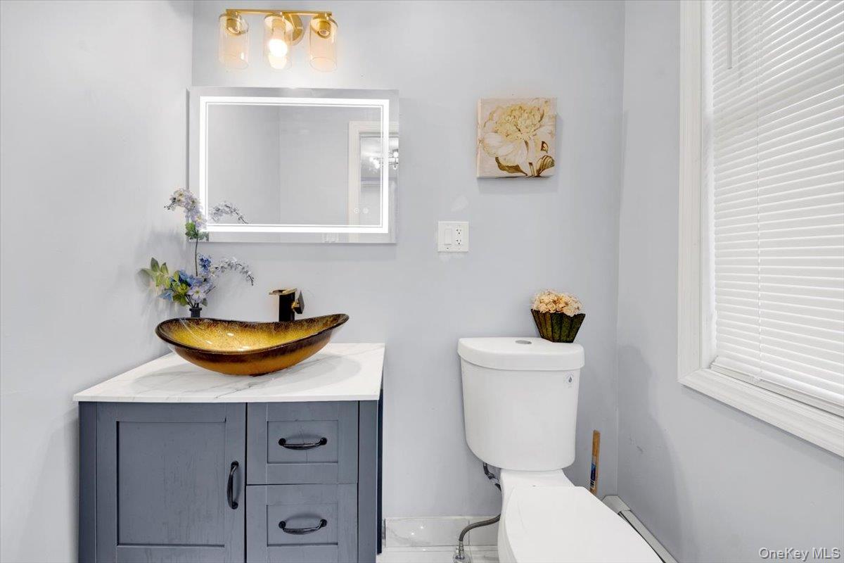 75 West Kingsbridge Road Mount Vernon, NY 10550 - Photo 13 of 37 Bathroom featuring vanity and toilet