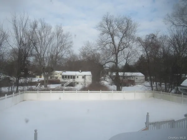 a view of white house with a yard